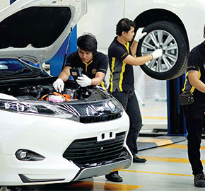 Brand new car tyres stacked in auto repair garage